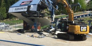 Chairlift being demolished with machinery