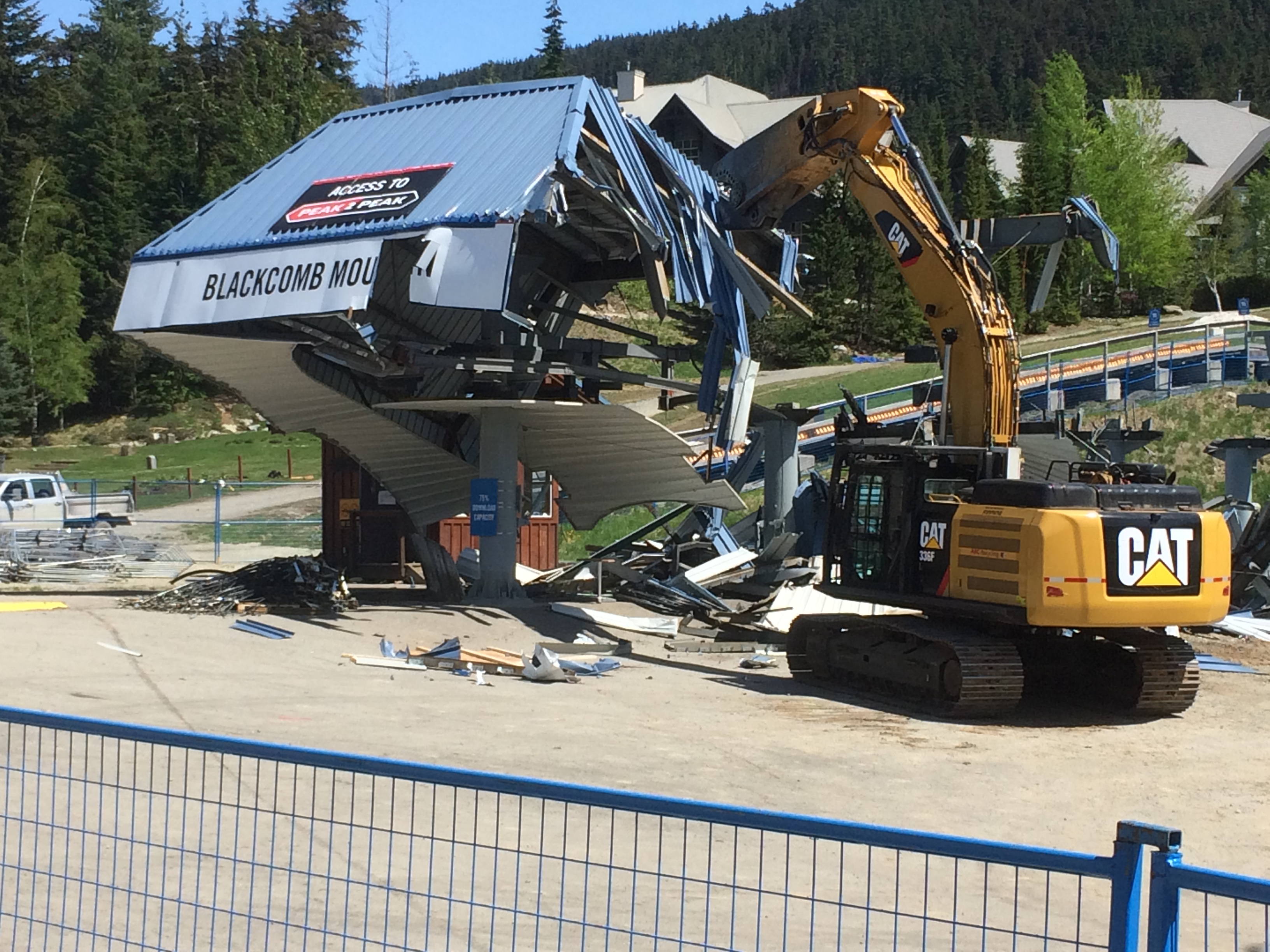 Chairlift being demolished with machinery