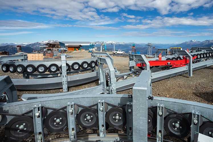 chairlift parts waiting on the ground to be installed